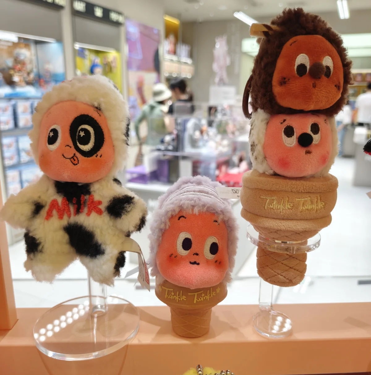 Three Twinkle figures on display stand